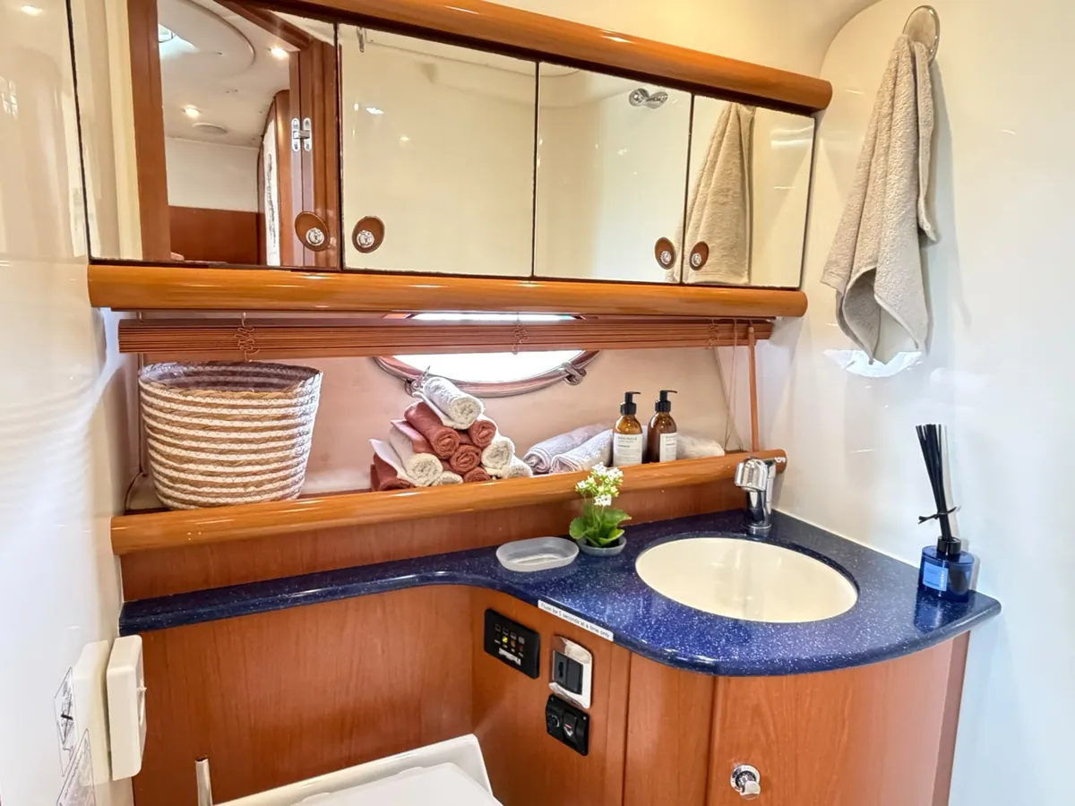 The bathroom: basin, mirror and fresh towels